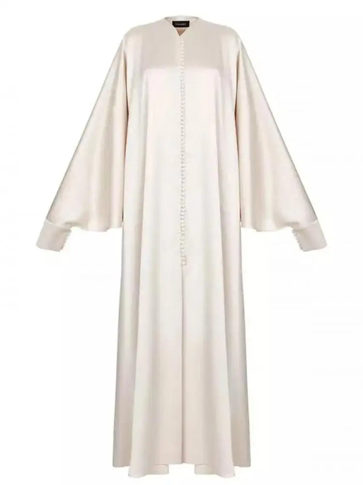 Elevate your modest wardrobe with this elegant floor-length abaya, designed for comfort and effortless style. Featuring a flattering round neckline, long batwing sleeves, and a loose, flowing silhouette, this solid-color robe offers full coverage